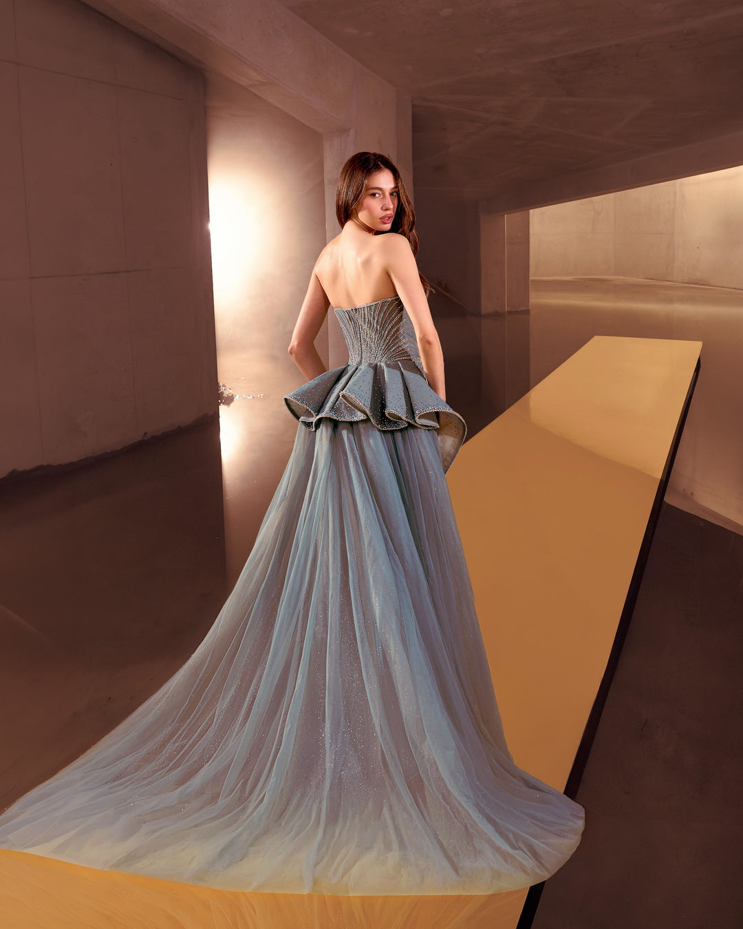 Delilah LD12089 Strapless Plunging Crystal Mermaid Gown with Peplum and Tulle Overskirt - Green back view
