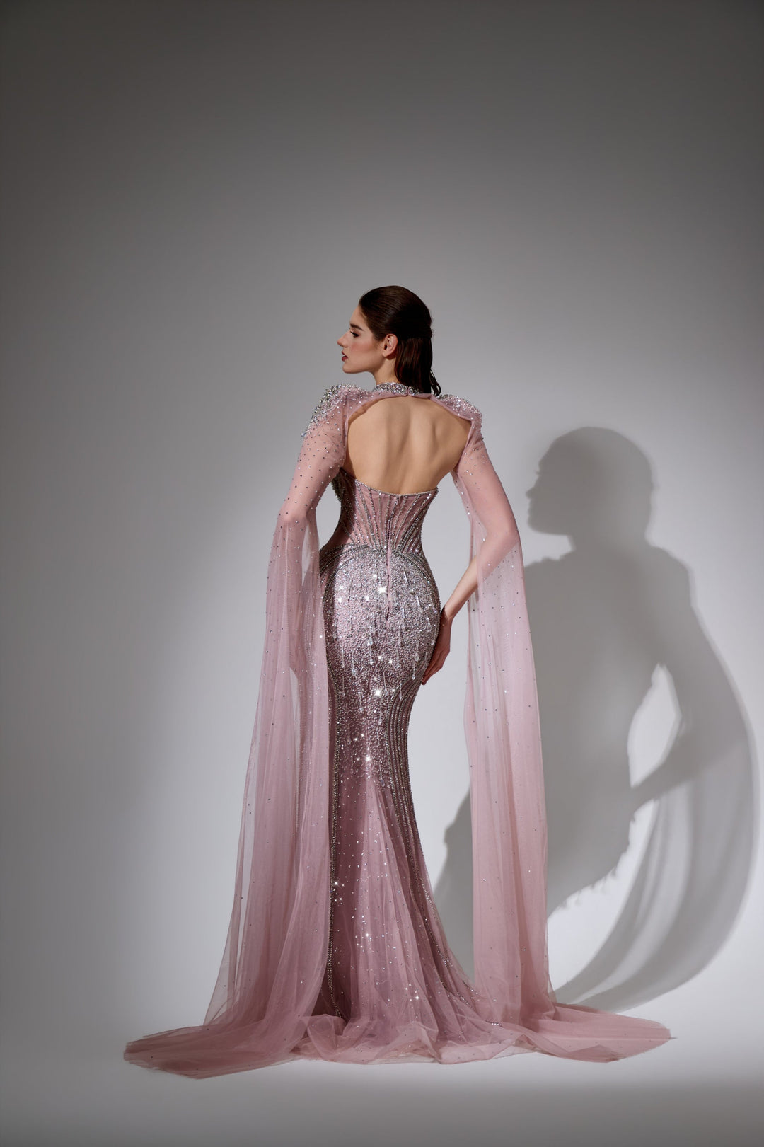 Delilah LD11478 Strapless Beaded Corset Mermaid Gown with Choker Capelet and Floor-Length Cape Sleeves - Pink back view