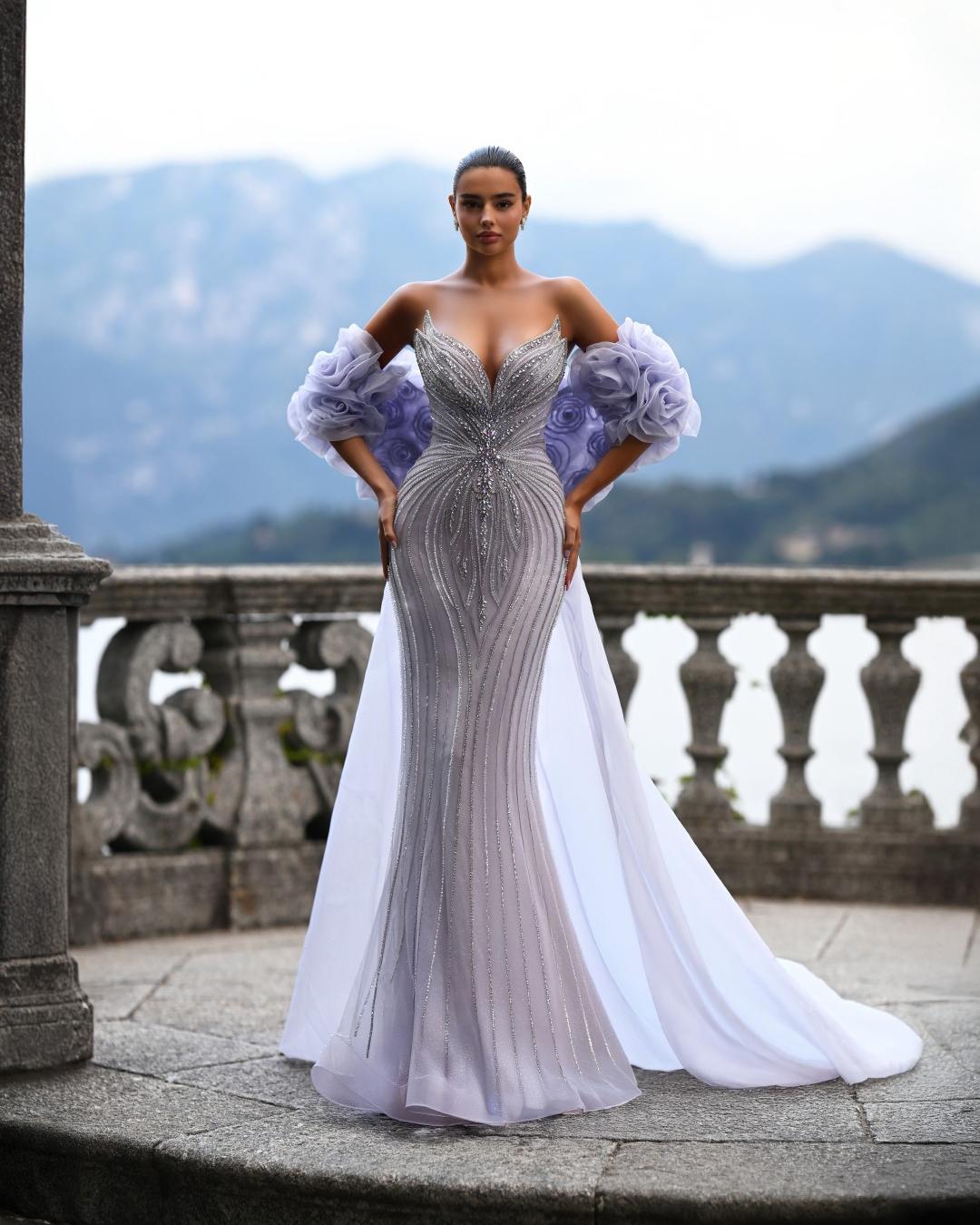 Delilah SH12052 Plunging Beaded Corset Mermaid Gown with Rosette Arm Puffs and Overskirt - Lavender front view