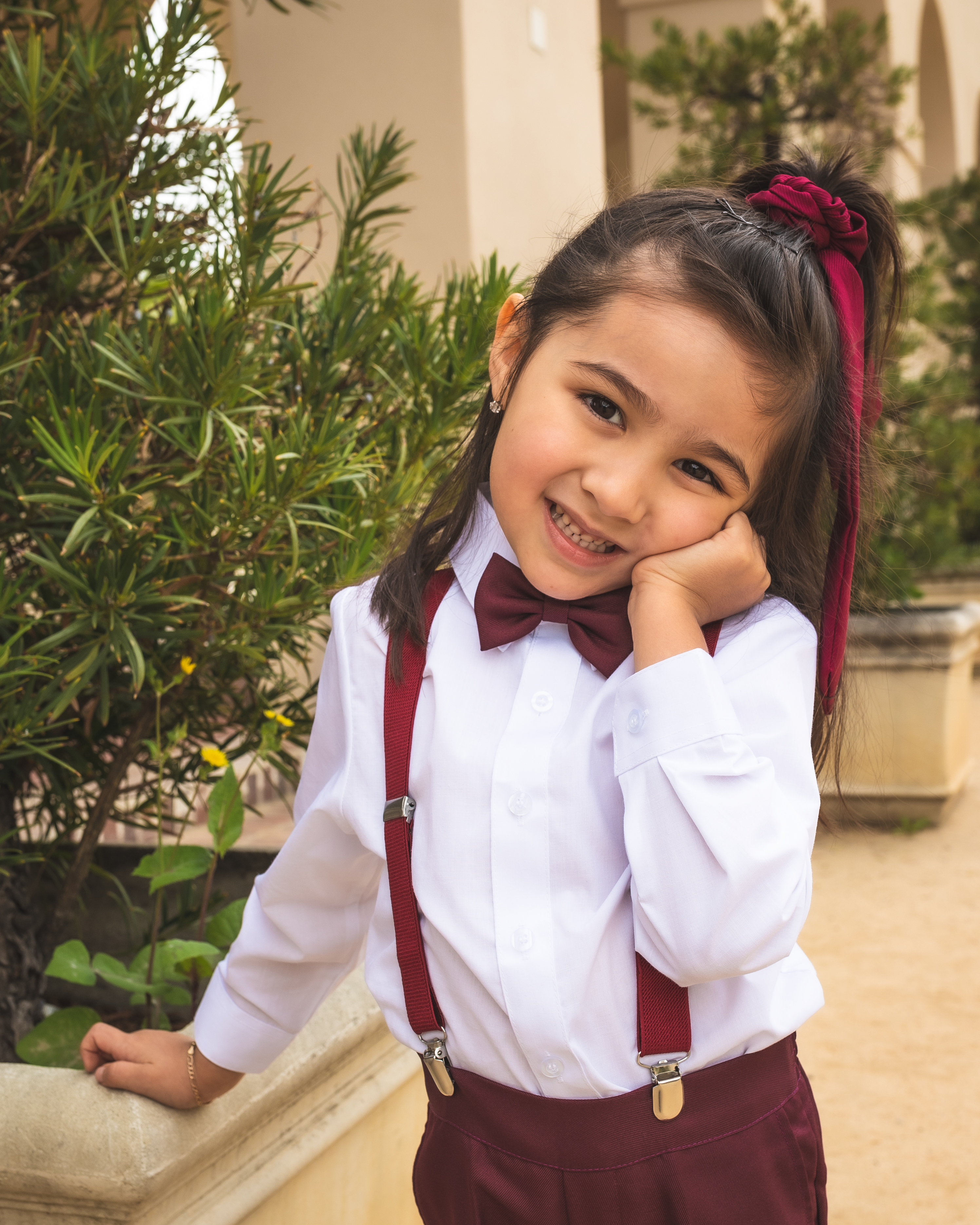 burgundy bow tie and suspenders wedding
